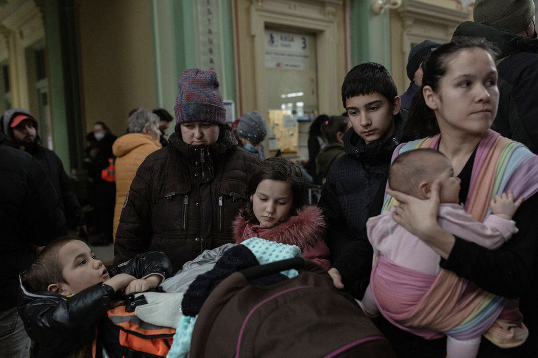 Ukrainian refugees, including many children and women, arrive by trains at Przemyśl station in Poland.